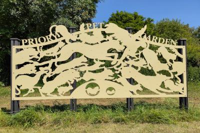 Sign showing animals with the words Priory Pet Garden
